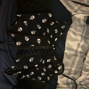 Unused Skull Corset, lace ties in the front and hooks in the back. Size: Medium
